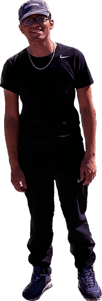 a man wearing a black hat and black pants