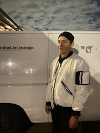 a man standing in front of a van