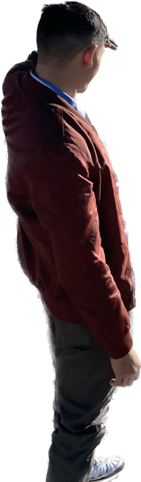 a man wearing a red jacket and a pair of sneakers