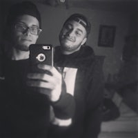 black and white photo of two men taking a selfie